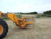 Wrapped Bale Clamp for handing wrapped silage bales.