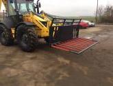 8ft wide Muck Fork with filled in middle, top greedy board and road safe bar