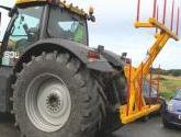 Hydraulically folding Big Bale Transporter for the back of tractors.